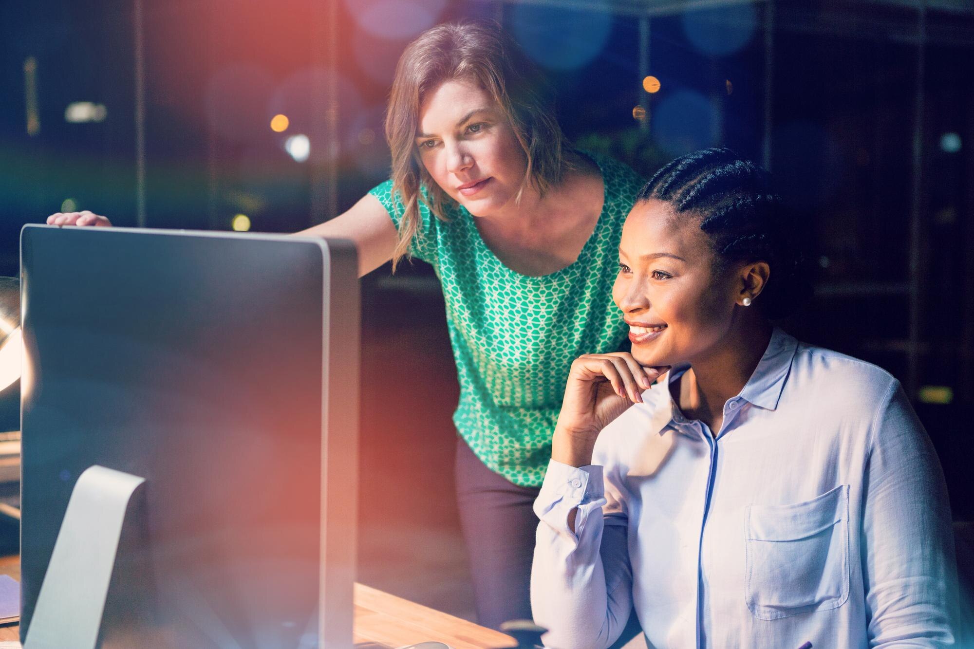 woman looking at computer supporting inclusivity and accessibility