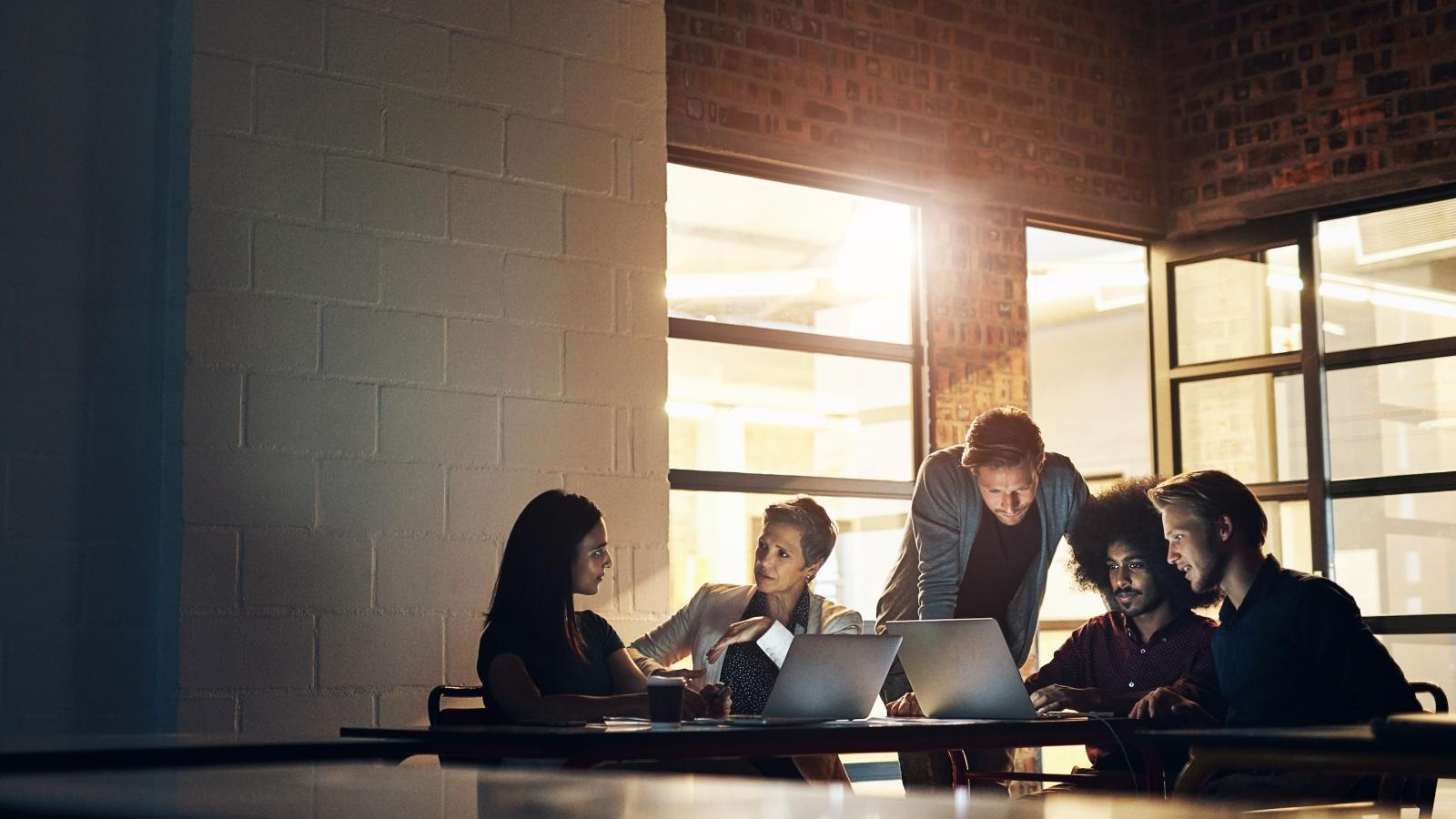 Collaboration group working in digital strategy at night in the boardroom