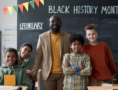 Teacher with pupils at school for Black History Month