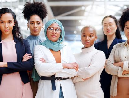 6 empowered women in tech standing against a wall