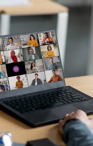 a group meeting on a laptop screen